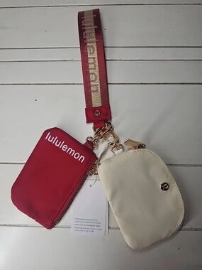 lululemon athletica Cream Wristlet with Burgundy Accent